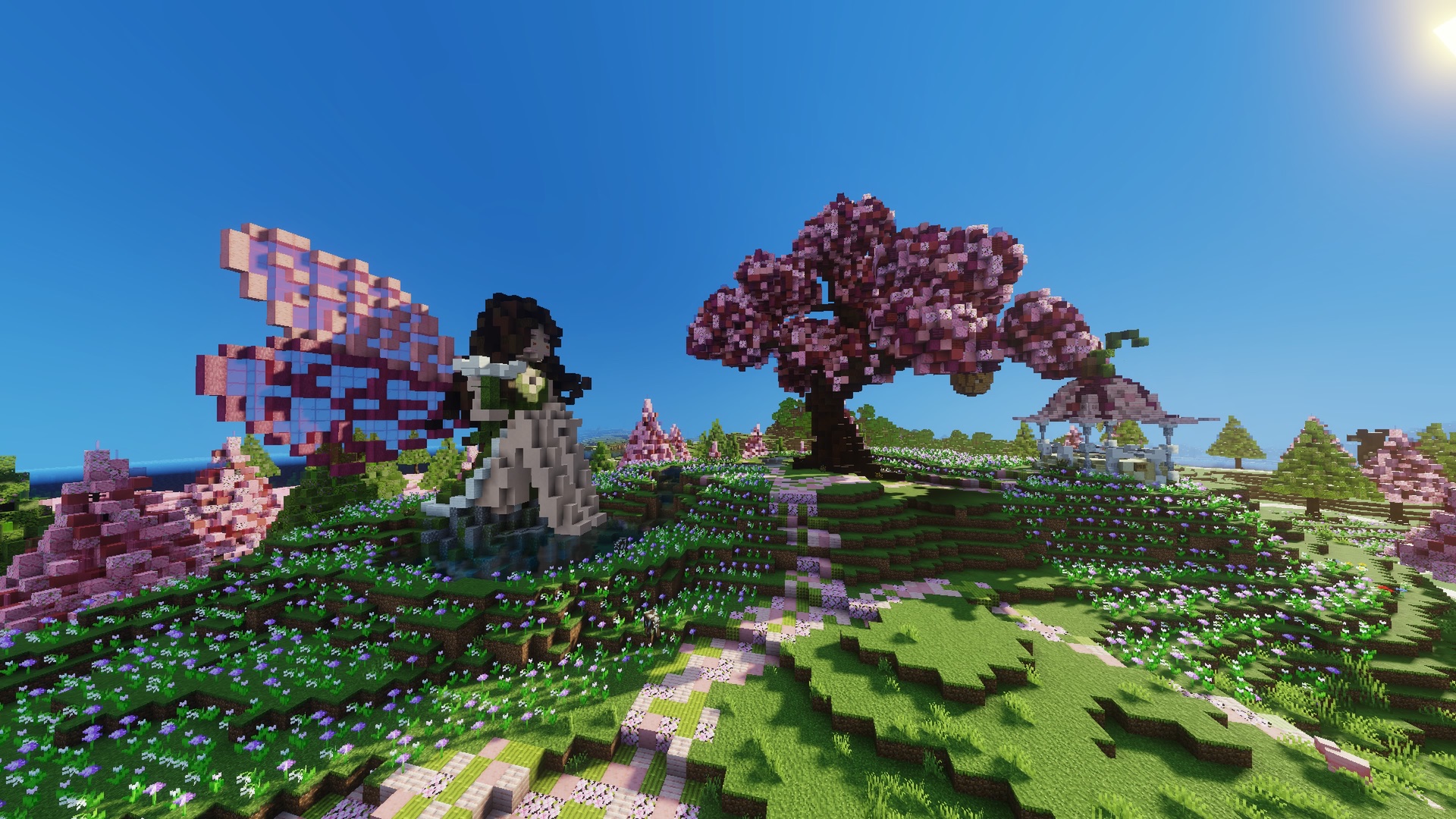 A giant pink tree, flower fields and a fairy statue in Petalia